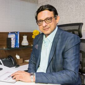 Dr. Chandresh dental specialist at DentiCare India
